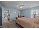 Cozy bedroom featuring carpeted floor, a ceiling fan, and a doorway to another room at 1295 Kerr St, Burlington, NC 27215