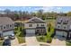 A two-story home with a well-manicured lawn, a long driveway, and an attached two car garage at 1295 Kerr St, Burlington, NC 27215