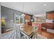 Open kitchen/dining area with modern cabinets, an island, and stainless steel appliances at 1295 Kerr St, Burlington, NC 27215