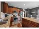 Modern kitchen with granite countertops, stainless steel appliances, and wood cabinetry at 1295 Kerr St, Burlington, NC 27215