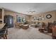 Spacious living room with lots of seating, neutral carpet, and a large window at 1295 Kerr St, Burlington, NC 27215