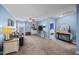 Spacious living room with sofa, built-in shelves, large window, and doorways to other areas at 1295 Kerr St, Burlington, NC 27215