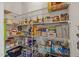 Walk-in pantry providing ample storage space with wire shelving fully stocked with food at 1295 Kerr St, Burlington, NC 27215