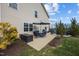 Backyard patio featuring a dining set, grill, lush lawn, and privacy fence at 1295 Kerr St, Burlington, NC 27215