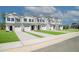 New construction townhomes featuring attached garages, neutral siding, and well-manicured lawns at 132 Rolesville Ridge Dr, Rolesville, NC 27571