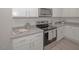 Detailed view of a modern kitchen with stainless steel appliances and sleek countertops at 132 Rolesville Ridge Dr, Rolesville, NC 27571