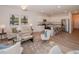 Bright living space with modern decor, flowing into an open-concept kitchen with stainless steel appliances at 132 Rolesville Ridge Dr, Rolesville, NC 27571