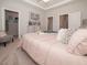 Comfortable bedroom featuring plush bedding, tray ceiling, and ample closet space at 132 Rolesville Ridge Dr, Rolesville, NC 27571