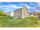 Backyard featuring a lush lawn and view of other houses at 1320 Rushing Creek Pkwy, Raleigh, NC 27610