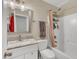 Bathroom with a shower and tub combination, single sink vanity with marble countertops, and modern fixtures at 1320 Rushing Creek Pkwy, Raleigh, NC 27610