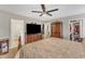 Spacious bedroom featuring a ceiling fan, TV on dresser, and armoire at 1320 Rushing Creek Pkwy, Raleigh, NC 27610