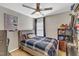 Bedroom with a ceiling fan and window providing natural light, creating a restful atmosphere at 1320 Rushing Creek Pkwy, Raleigh, NC 27610
