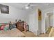 Bedroom featuring a ceiling fan, natural light, and warm tones creating a relaxing space at 1320 Rushing Creek Pkwy, Raleigh, NC 27610