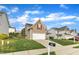Well-kept home with tan siding, red shutters, a two-car garage, and a neatly maintained lawn on a sunny day at 1320 Rushing Creek Pkwy, Raleigh, NC 27610