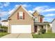 Two-story home with tan siding, a white garage door, red shutters and a well-manicured lawn in a suburban neighborhood at 1320 Rushing Creek Pkwy, Raleigh, NC 27610