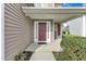 Inviting front porch with a dark red front door, matching shutters, and neutral siding for a welcoming entryway at 1320 Rushing Creek Pkwy, Raleigh, NC 27610