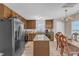 Open kitchen layout with granite countertops, stainless steel appliances, and adjacent dining area for easy entertaining at 1320 Rushing Creek Pkwy, Raleigh, NC 27610