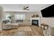 Cozy living room featuring a fireplace, comfortable seating, and a ceiling fan at 1320 Rushing Creek Pkwy, Raleigh, NC 27610