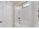 Shower and tub combination with white interior and adjustable showerhead, offering a clean and modern design at 1320 Rushing Creek Pkwy, Raleigh, NC 27610