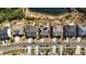 Bird's eye view of a pond nestled behind houses on a suburban street at 1624 Pantego Trl, Cary, NC 27519