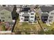 Aerial view of a home with a large backyard, privacy fence, and solar panels on the roof at 1624 Pantego Trl, Cary, NC 27519