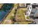 Aerial view of the backyard featuring a fence, small trees, and a water view at 1624 Pantego Trl, Cary, NC 27519