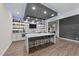 A large entertainment bar with a large island, tile details, and LED lighting at 1624 Pantego Trl, Cary, NC 27519