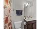 Cozy bathroom includes a vanity with a sink, dark wood cabinets, and a shower with a curtain at 1624 Pantego Trl, Cary, NC 27519