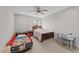 Inviting bedroom includes carpet flooring, ceiling fan, and a racecar bed at 1624 Pantego Trl, Cary, NC 27519