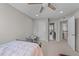 bedroom features neutral walls, a fan, and access to other rooms at 1624 Pantego Trl, Cary, NC 27519