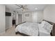 Comfortable bedroom includes a ceiling fan, neutral carpet flooring, and an en-suite bathroom at 1624 Pantego Trl, Cary, NC 27519