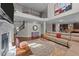 Spacious living room featuring hardwood floors, a cozy fireplace, and seamless access to the modern kitchen at 1624 Pantego Trl, Cary, NC 27519