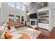 Spacious living room with a large fireplace, tall ceilings, and large windows at 1624 Pantego Trl, Cary, NC 27519