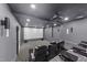 A professionally designed home theater, complete with tiered seating and a large screen at 1624 Pantego Trl, Cary, NC 27519