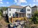 A stunning backyard with a fire pit and outdoor seating for a cozy and inviting space at 1824 Longmont Dr, Wake Forest, NC 27587