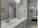 Bathroom with a double vanity, neutral color scheme, and tile floors at 1824 Longmont Dr, Wake Forest, NC 27587