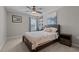 Cozy bedroom featuring a ceiling fan, a painting, and a work desk at 1824 Longmont Dr, Wake Forest, NC 27587