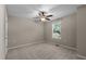 Empty bedroom featuring a ceiling fan and natural light from a window at 1824 Longmont Dr, Wake Forest, NC 27587