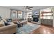Cozy living room with a stone fireplace, built-in shelving, and comfortable seating at 1824 Longmont Dr, Wake Forest, NC 27587