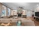 Spacious living room with a stone fireplace, built-in shelves, and ample natural light at 1824 Longmont Dr, Wake Forest, NC 27587
