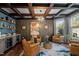 Elegant living room featuring coffered ceilings, a bar area and ample natural light at 1824 Longmont Dr, Wake Forest, NC 27587