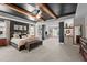 Large main bedroom with tray ceiling, wood beams, sitting area, and elegant decor at 1824 Longmont Dr, Wake Forest, NC 27587