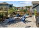Charming patio with brick fire pit and Adirondack chairs is perfect for outdoor entertaining at 1824 Longmont Dr, Wake Forest, NC 27587