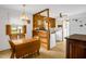 Vintage kitchen with wood cabinets, eat-in dining, and bright natural light at 200 N 9Th St, Erwin, NC 28339