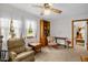 Inviting living room with a ceiling fan, natural light, and comfortable seating near a bookcase at 200 N 9Th St, Erwin, NC 28339