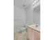 Bright bathroom featuring toilet and single sink vanity with ample lighting and neutral colors at 2011 Wolftech Ln # 203, Raleigh, NC 27603