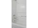 Bright white bathtub and shower combination with chrome fixtures at 2011 Wolftech Ln # 203, Raleigh, NC 27603