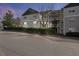Multi-level apartment building with green and gray siding at 2011 Wolftech Ln # 203, Raleigh, NC 27603