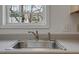 Close-up of the kitchen sink featuring modern fixtures and a window view at 2011 Wolftech Ln # 203, Raleigh, NC 27603