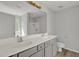 Bright bathroom featuring a double sink vanity, large mirror, and a convenient walk-in shower at 209 Kellerhis Dr, Apex, NC 27502